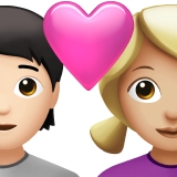 Пара з серцем: людина, жінка, світлий тон шкіри, середньо-світлий тон шкіри для Apple iOS 18.4