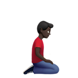 Мужчина стоит на коленях, смотрит вправо: темный оттенок кожи для Apple iOS 18.4