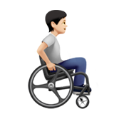 Людина в ручному інвалідному візку, дивиться праворуч: світлий тон шкіри для Apple iOS 18.4