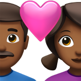 Couple avec cœur - Homme : teint moyen-foncé, Femme : teint moyen-foncé pour Apple iOS 26.4