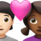 Casal com coração: Pessoa, Mulher, Tom de pele claro, Tom de pele médio-escuro para Apple iOS 26.4