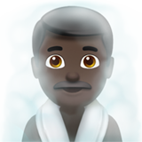 Mężczyzna w zaparowanym pomieszczeniu: karnacja ciemna dla Apple iOS 26.4