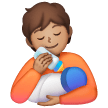 Personne Nourrissant Un Bébé: Peau Moyenne Personne Nourrissant Un Bébé: Peau Moyenne
