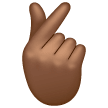 Hand met wijsvinger en duim gekruist: donkergetinte huidskleur voor Samsung One UI 8.5