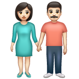 हाथ में हाथ लिए महिला–पुरुष: हल्के रंग की त्वचा
